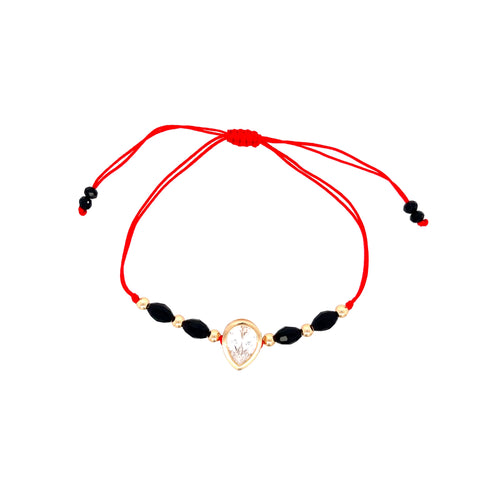 The Big Zirconia Red String Lucky Bracelet and Black Beads Rope showcases black beads and 14k gold-filled accents, complemented by a teardrop-shaped pendant adorned with a sparkling Cubic Zirconia stone.